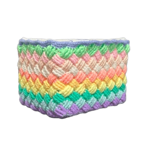 Side view of handmade crochet rainbow basket, compact and vibrant storage, 14 x 20 x 16 cm.